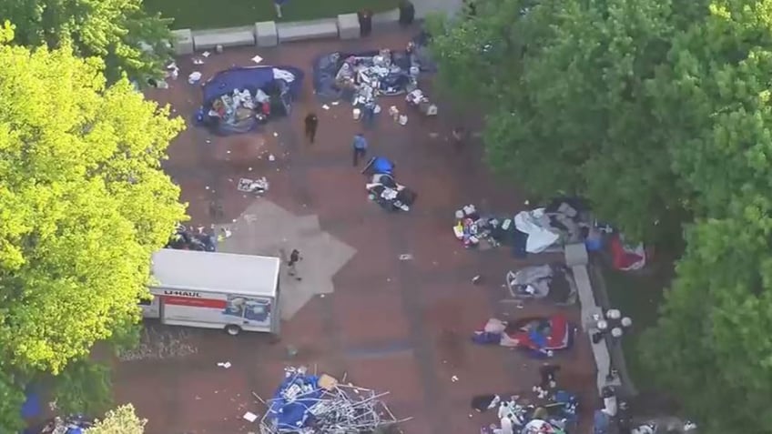 police cleaning up encampment