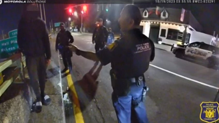 police dash to save man dangling from overpass in dramatic bodycam footage