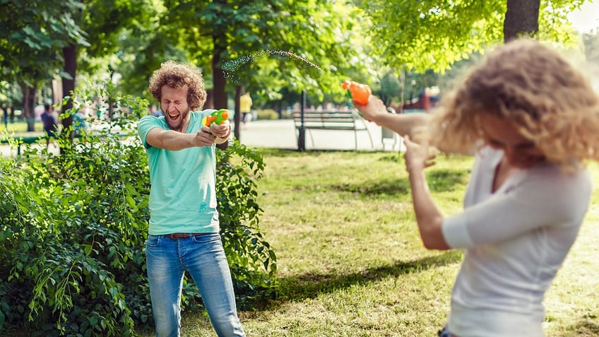 People using water guns
