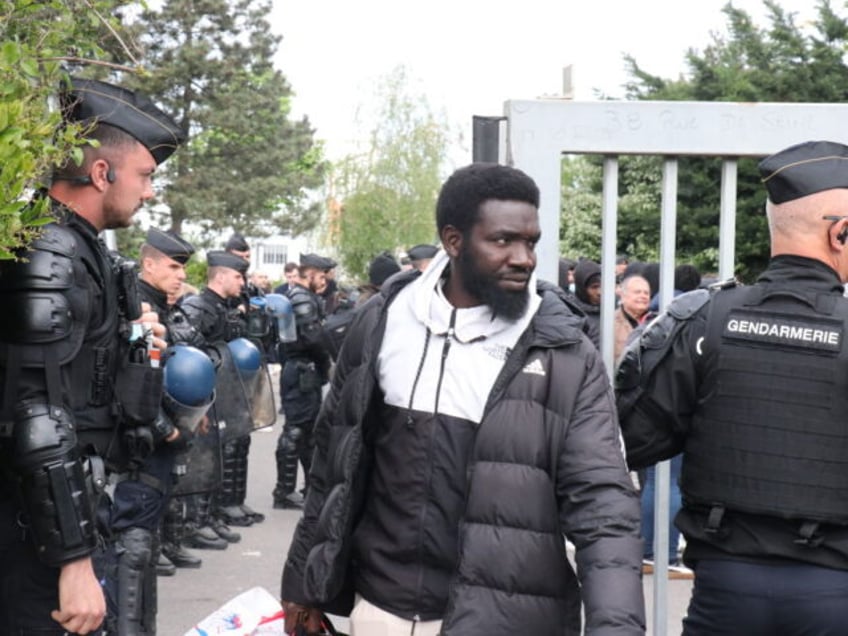 PARIS, FRANCE - APRIL 17: Police evacuate a building inhabited by about 450 people, mostly