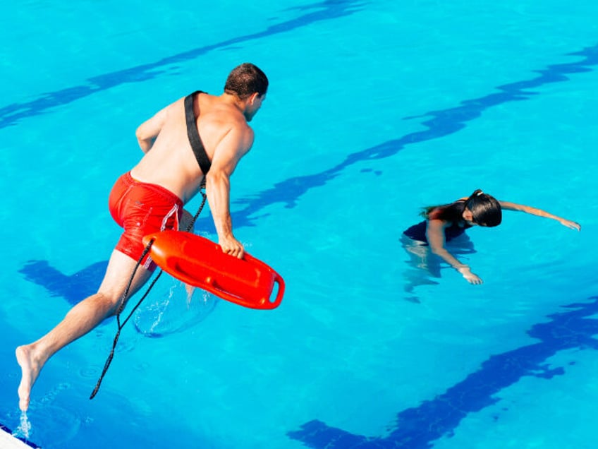 Lifeguard in action - stock photo