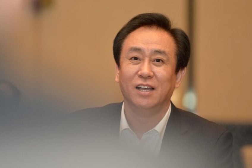 police hold boss of troubled developer china evergrande report