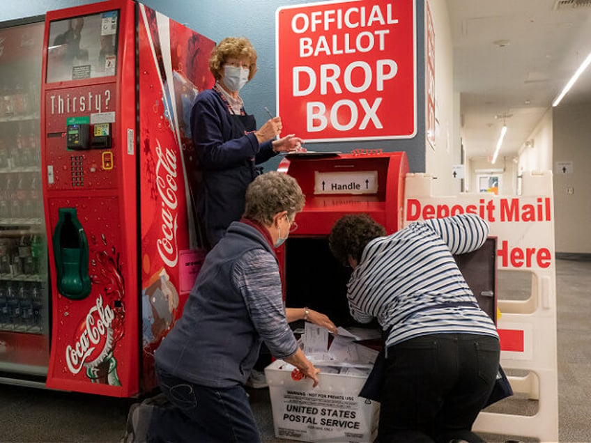 VANCOUVER, WA - NOVEMBER 03: Election workers collect returned ballots on November 3, 2020