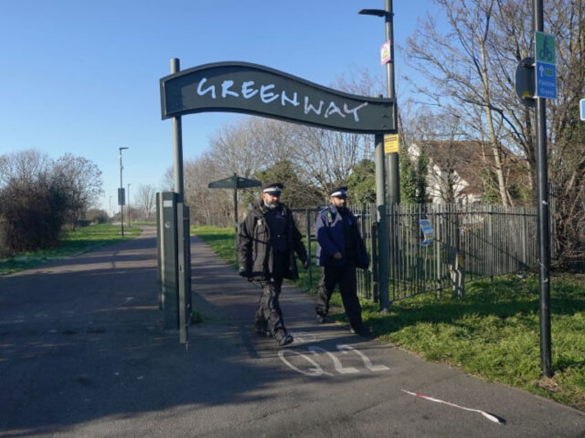 Police and Community Support Officers at the junction of the Greenway and High Street South in Newham, east London, where a newborn baby was found in a shopping bag by a dog walker. The girl, who police say is well and not injured, was discovered wrapped in a towel and …