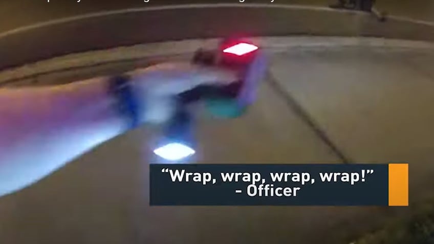 The restrain wraps wires around the suspect and iThe restrain wraps wires around the suspect and immbolizes him/her.mmbolizes him/her. 