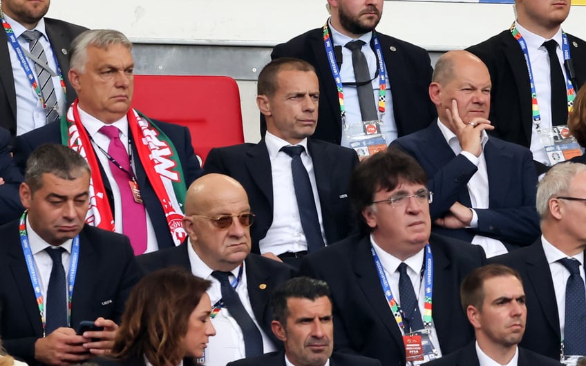 STUTTGART, GERMANY - JUNE 19: Hungary's Prime Minister Viktor Orban , UEFA President Aleksander Ceferin and German Chancellor Olaf Scholz (R) attend the UEFA EURO 2024 group stage match between Germany and Hungary at Stuttgart Arena on June 19, 2024 in Stuttgart, Germany. (Photo by Stefan Matzke - sampics/Getty Images)