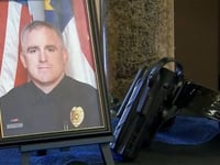 Police officer killed in North Carolina grocery store shooting just days before Christmas