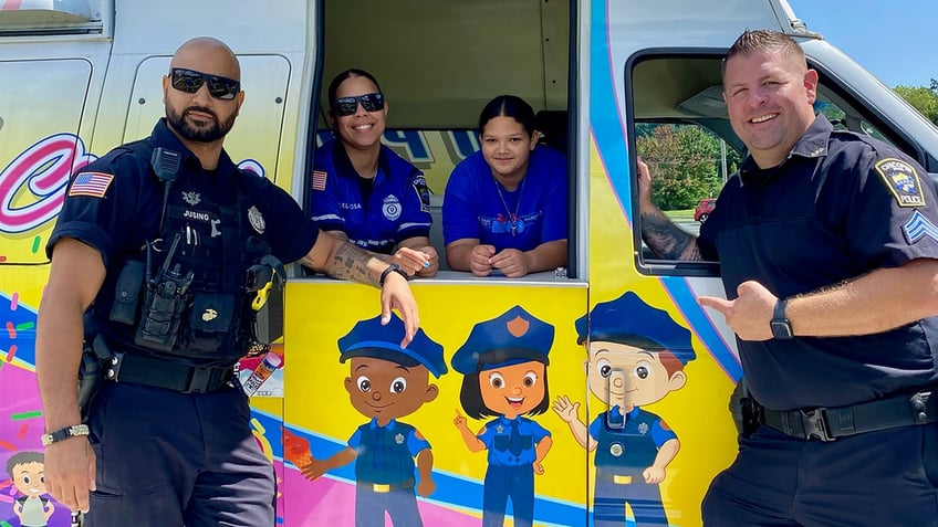 Four people in an ice cream truck.