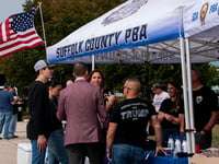 Police officers tailgate at Trump rally, call for death penalty for cop killers