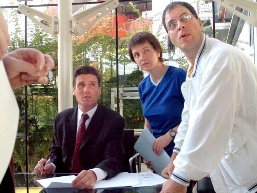 FILE - British environmental activists Helen Steel, second right, and David Morris, right,