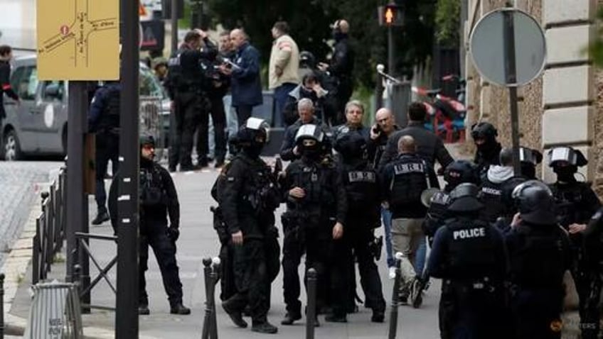 police surround iran consulate in paris where man threatens to blow himself up