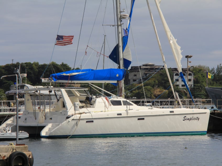 The yacht "Simplicity", that officials say was hijacked by three escaped prisoners with two people aboard, is docked at the St. Vincent and the Grenadines Coastguard Service Calliaqua Base, in Calliaqua, St. Vincent, Friday, Feb. 23, 2024. Authorities in the eastern Caribbean said they were trying to locate two people believed to be U.S. citizens who were aboard the yacht that was hijacked by the three escaped prisoners from Grenada. (AP Photo/Kenton X. Chance)