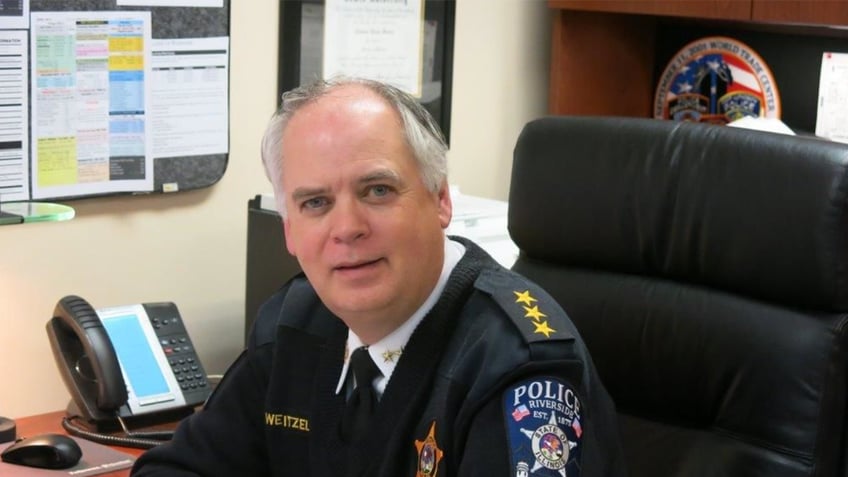 Retired Illinois police chief at desk