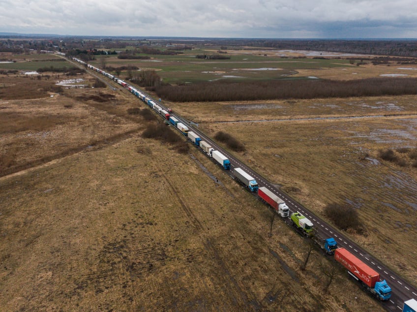 DOROHUSK, POLAND - FEBRUARY 20: An aerial view shows hundreds of trucks waiting in line as an ongoing blockade by Polish farmers continues on the Dorohusk Polish-Ukrainian border crossing on February 20, 2024 in Dorohusk, Poland. The long-running blockade centers on demands by Polish farmers and truckers to restrict imports of Ukrainian agricultural products. (Photo by Omar Marques/Getty Images)