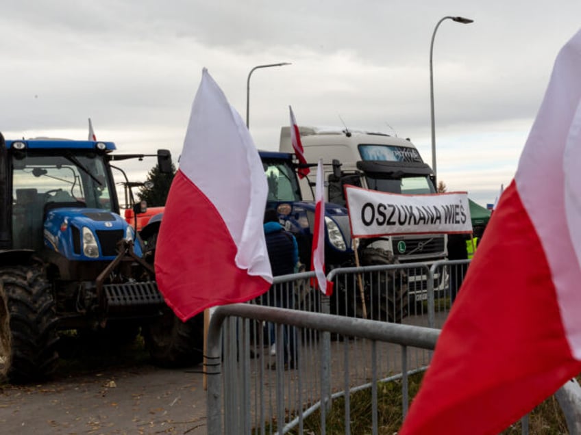 Polish flags are seen as farmers stand on a strike post as they block truck transport in Medyka - another border crossing between Poland and Ukraine, on November 23, 2023. The farmers joined the transport sector in the strike against poor management of agricultural imports of Ukrainian produce as well …