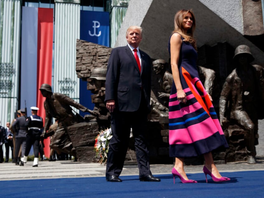 President Donald Trump walks with first lady Melania Trump to deliver a speech at Krasinsk