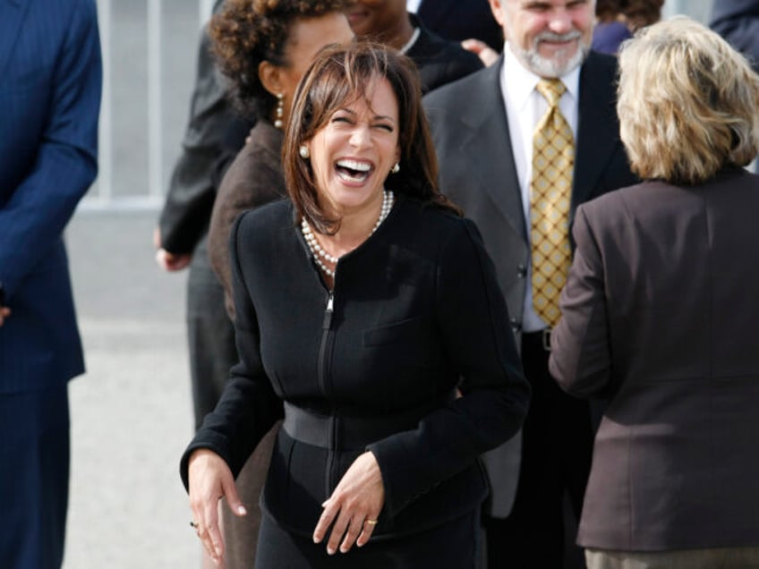 San Francisco District Attorney Kamala Harris laughs during the arrival of President Obama