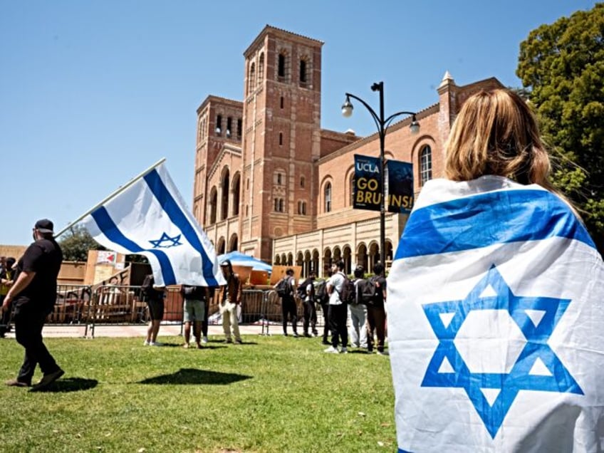 Westwood, CA - April 29:Israel supporters look on at a Pro-Palestinian encampment in front