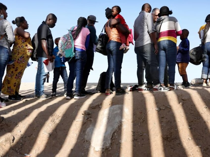 YUMA, ARIZONA- MAY 20: Immigrants from Haiti, who crossed through a gap in the U.S.-Mexico