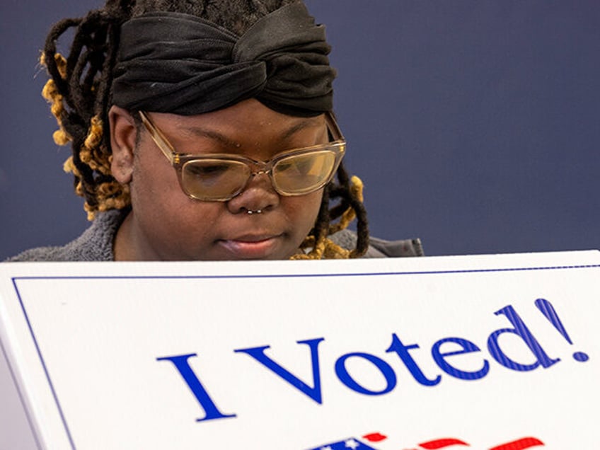 A woman casts her ballot at Ladson Elementary during the Democratic primary on February 3,