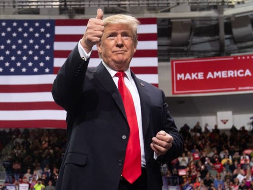 US President Donald Trump gives a thumbs up during a Make America Great Again rally in Gre