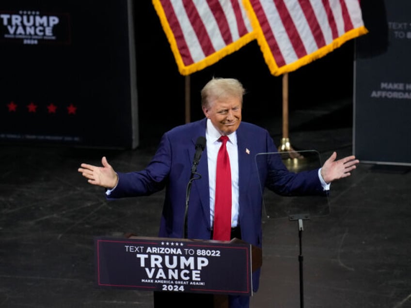 Republican presidential nominee former President Donald Trump pauses while speaking during