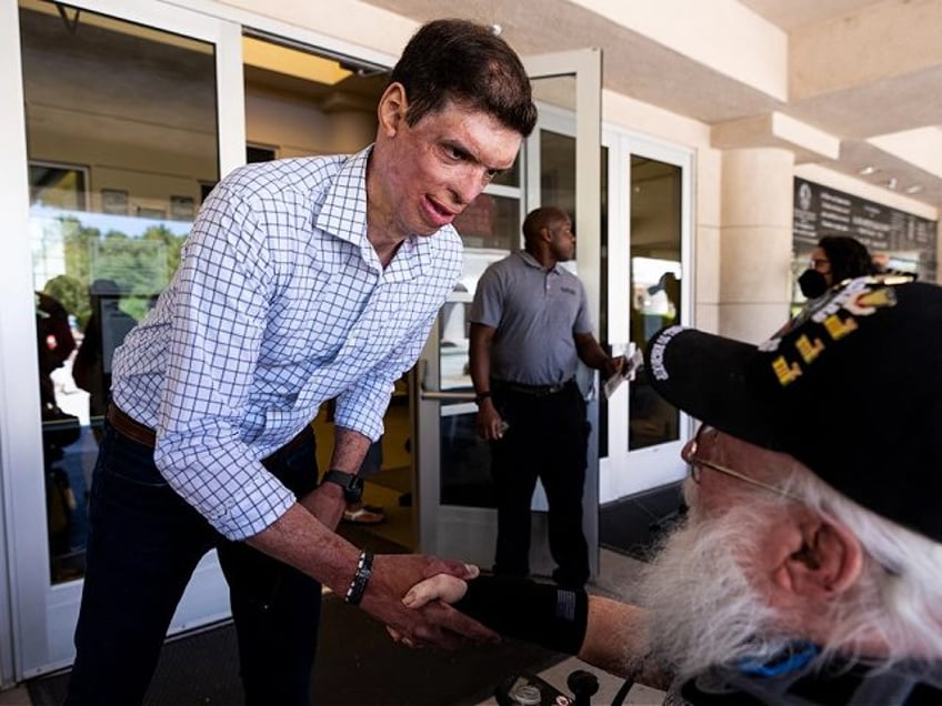 UNITED STATES - MAY 30: Nevada Republican candidate for U.S. Senate Sam Brown shakes hands