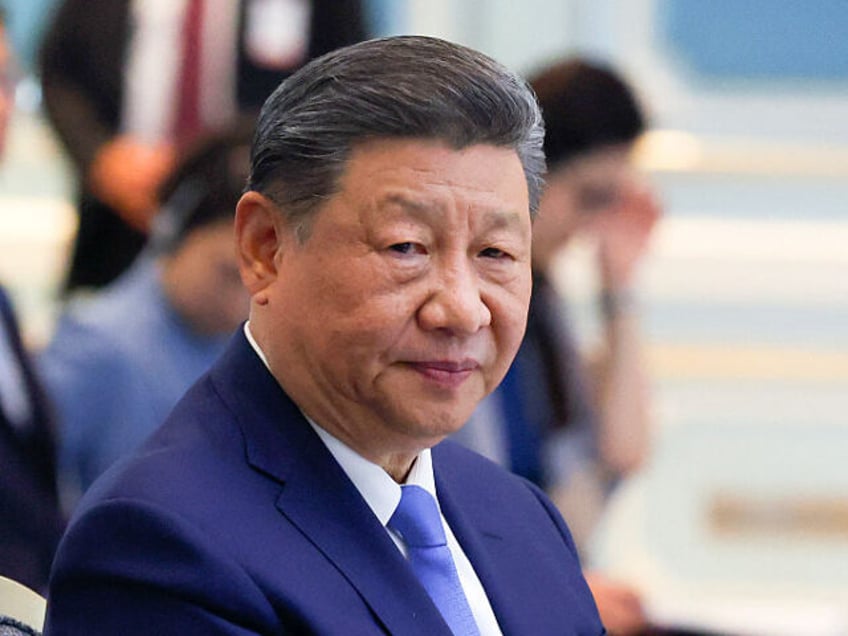 China's President Xi Jinping reacts during a bilateral meeting with Malaysia's P