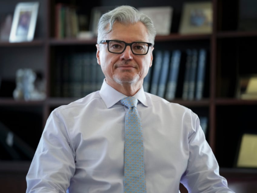 Judge Juan Merchan poses for a picture in his chambers in New York, Thursday, March 14, 2024. Merchan could become the first judge ever to oversee a former U.S. president’s criminal trial. He's presiding over Donald Trump’s hush money case in New York. (AP Photo/Seth Wenig)