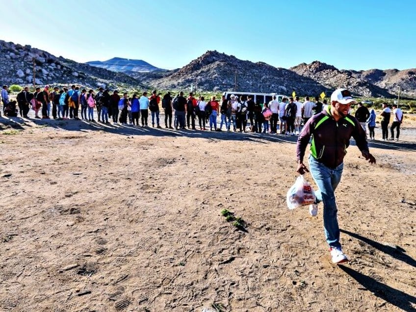 Jacumba Hot Springs, CA, Sunday, May 12, 2024 - Migrants line up to be transported by Bord