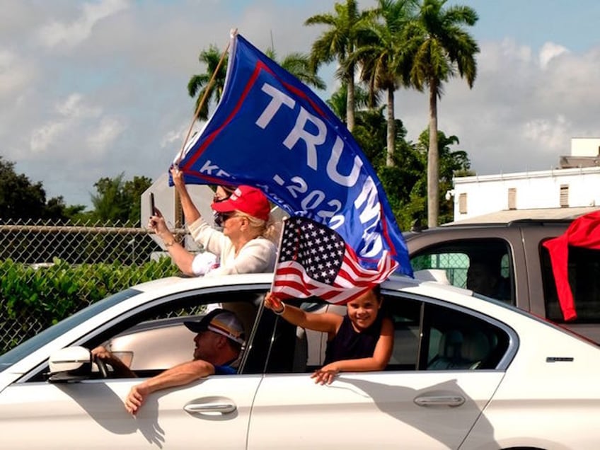 Supporters of President Donald Trump attend a mass caravan named 'Anticommunist Caravan' in Miami, Florida October 10, 2020. - Hundreds of cars participated October 10, 2020 in the anticommunist caravan organized by Cuban exiles in Miami. (Photo by GASTON DE CARDENAS / AFP) (Photo by GASTON DE CARDENAS/AFP via Getty Images)