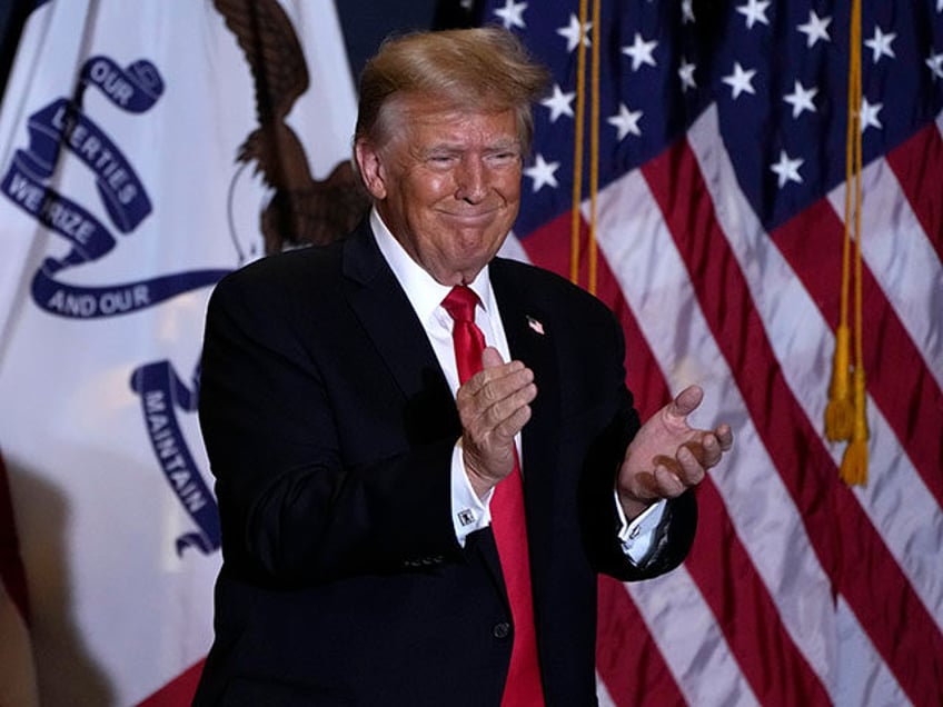 Former President Donald Trump walks off stage during a commit to caucus rally, Wednesday, Dec. 13, 2023, in Coralville, Iowa. (AP Photo/Charlie Neibergall)