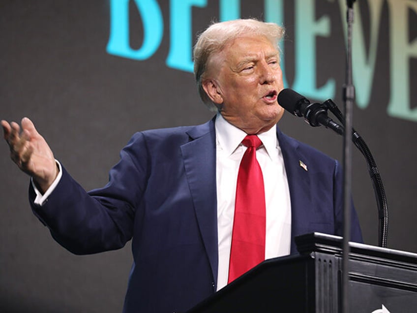 Former President of the United States Donald Trump speaking with attendees at The Believer