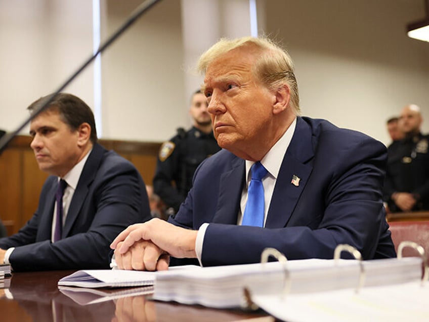 Former President Donald Trump awaits the start of proceedings during jury selection at Man