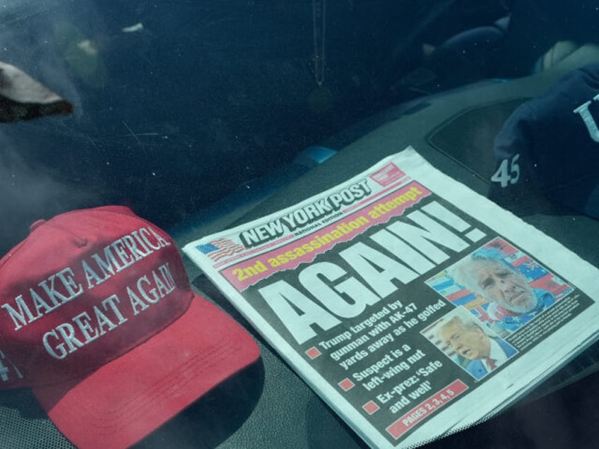 A newspaper is displayed in a vehicle outside of the Mar-a-Lago estate after the apparent