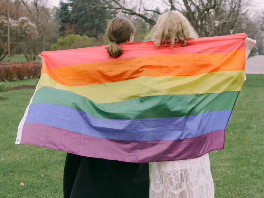 Women and rainbow flag