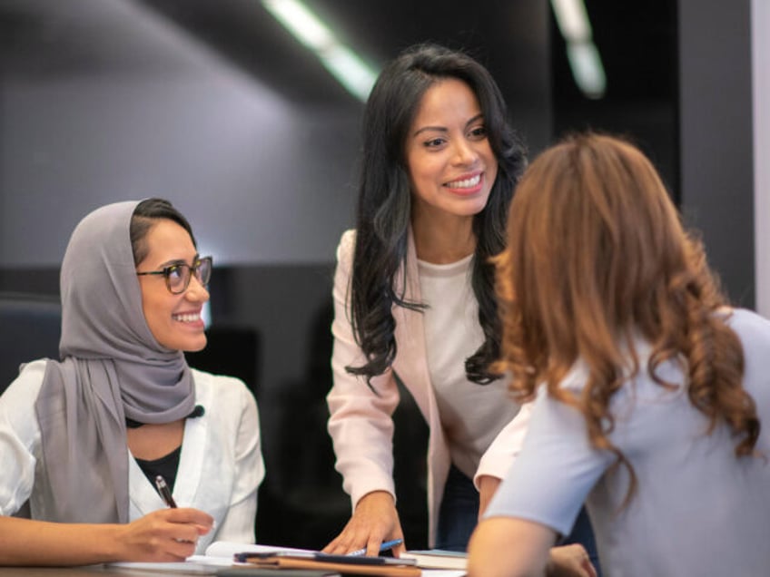 Female business team in strategy meeting - stock photo