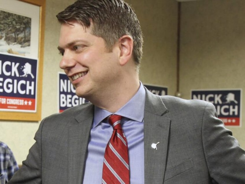 Nicholas Begich III, middle, speaks with supporters ahead of announcing his plans to run f