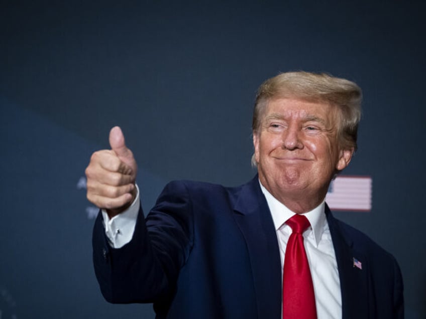 Former US President Donald Trump gives a thumbs up during the America First Policy Institu