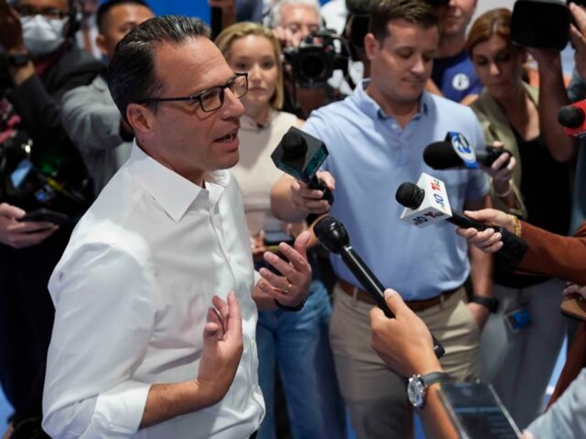 Pennsylvania Gov. Josh Shapiro speaks with members of the media during his visit to Philad