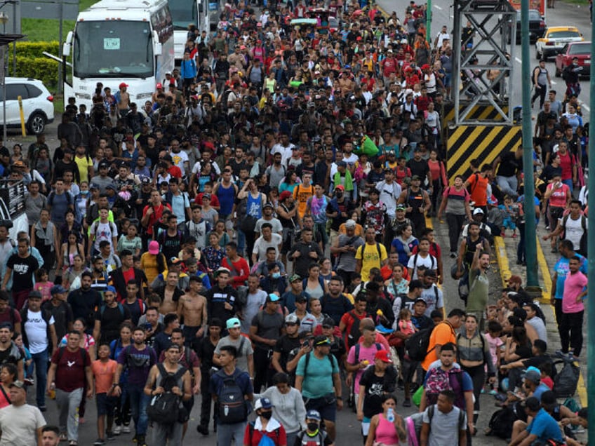 TOPSHOT - Latin American migrants take part in a caravan towards the border with the United States, in Huehuetan, Chiapas state, Mexico, on June 7, 2022. - President Joe Biden's plans to reboot US engagement with Latin America -- especially on critical topics like migration -- took a hit after …