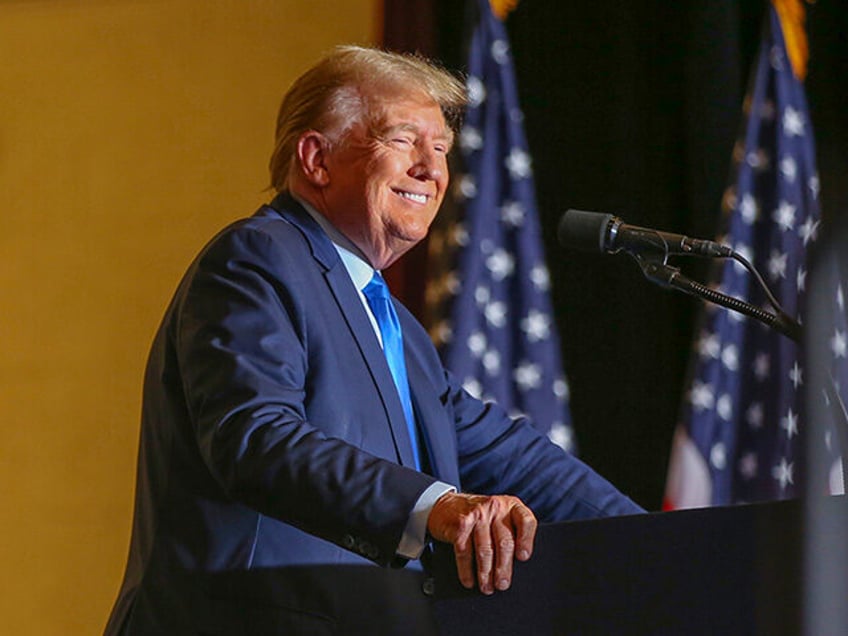 Former President Donald Trump greets the crowd at a campaign rally Saturday, Nov. 11, 2023, in Claremont, N.H. (AP Photo/Reba Saldanha)