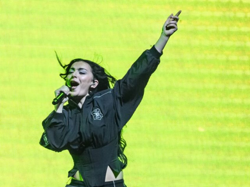 LONDON, ENGLAND - JUNE 27: Charli XCX joins Troye Sivan on stage during the Something to G