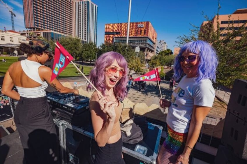 Three members of organization Joy to the Polls in Phoenix, Arizona, tried to soothe the ne