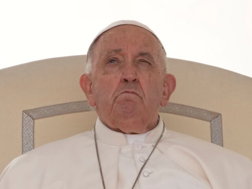 Pope Francis sits during his weekly general audience in St. Peter's Square, at the Va