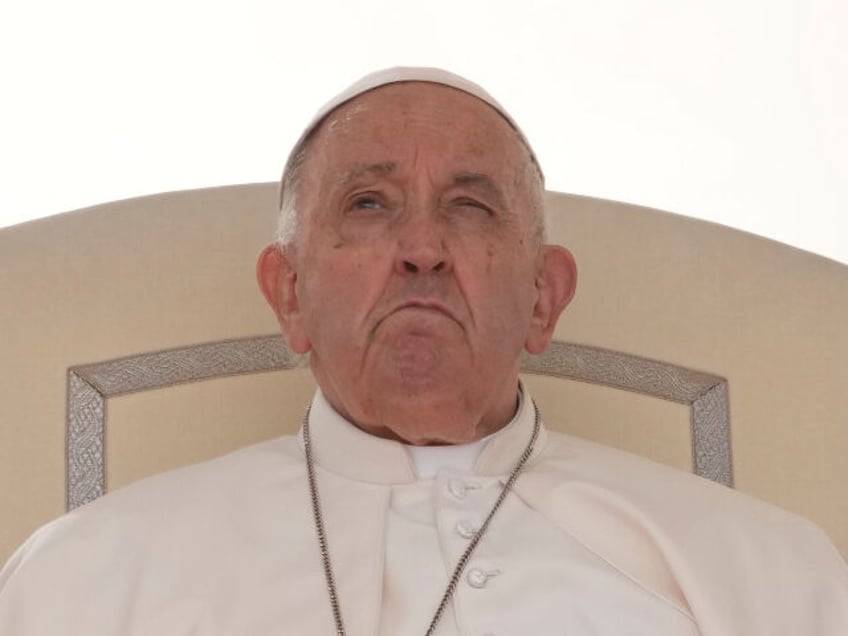 Pope Francis sits during his weekly general audience in St. Peter's Square, at the Va