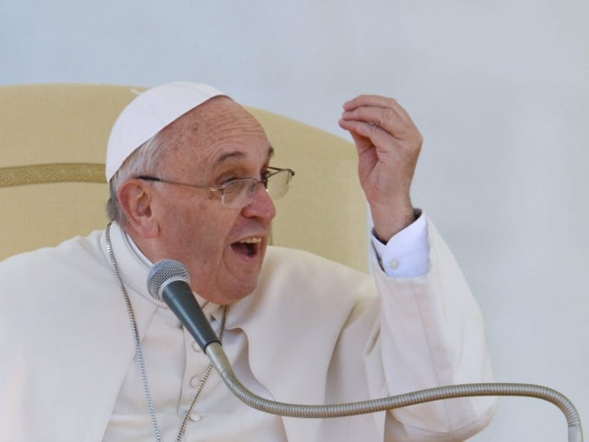 Pope Francis speaks to engaged couples during a Valentine's Day celebration in St Peter's square at the Vatican on February 14, 2014. The Vatican said there were around 20,000 future brides and grooms attending from 25 countries, all of them enrolled on Catholic marriage preparation courses. The celebration was not …