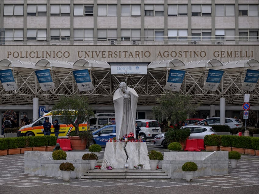 A general view shows the statue of Pope John Paul II outside the Policlinico A. Gemelli Ho