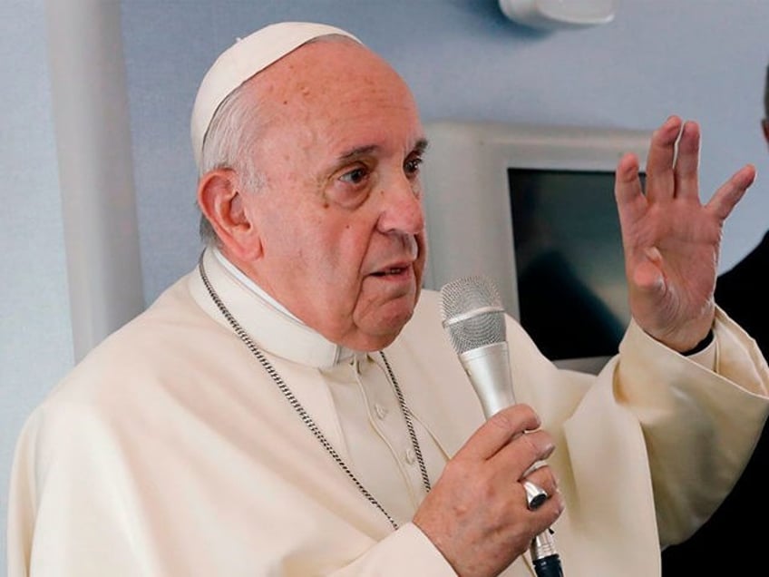 Pope Francis speaks to reporters during a news conference onboard the papal plane on his flight back from a week-long trip to Thailand and Japan, on November 26, 2019. (Photo by REMO CASILLI / POOL / AFP) (Photo by REMO CASILLI/POOL/AFP via Getty Images)