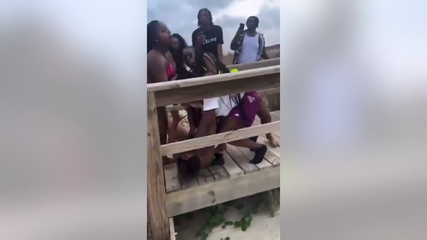 Two women fighting during Orange Crush on Tybee Island in Georgia